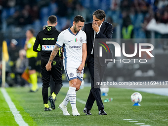 Simone Inzaghi head coach of FC Internazionale and Hakan Calhanoglu of FC Internazionale during the Serie A Enilive match between AS Roma an...