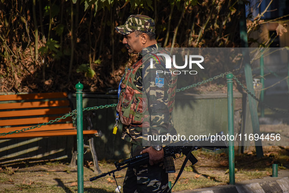 A security personnel stands guard in Srinagar, Jammu and Kashmir, on October 22, 2024. Security forces are on high alert after a recent mili...