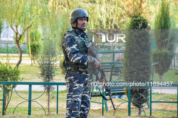 A security personnel stands guard in Srinagar, Jammu and Kashmir, on October 22, 2024. Security forces are on high alert after a recent mili...