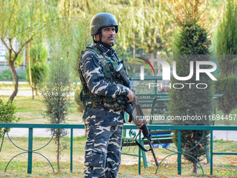 A security personnel stands guard in Srinagar, Jammu and Kashmir, on October 22, 2024. Security forces are on high alert after a recent mili...