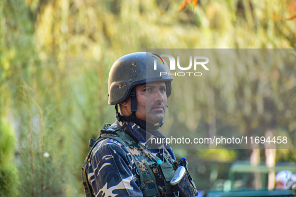 A security personnel stands guard in Srinagar, Jammu and Kashmir, on October 22, 2024. Security forces are on high alert after a recent mili...