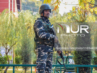 A security personnel stands guard in Srinagar, Jammu and Kashmir, on October 22, 2024. Security forces are on high alert after a recent mili...