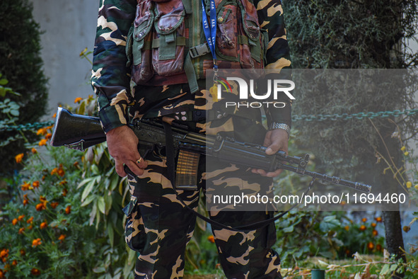 A security personnel stands guard in Srinagar, Jammu and Kashmir, on October 22, 2024. Security forces are on high alert after a recent mili...