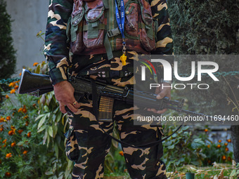 A security personnel stands guard in Srinagar, Jammu and Kashmir, on October 22, 2024. Security forces are on high alert after a recent mili...