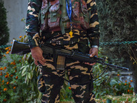 A security personnel stands guard in Srinagar, Jammu and Kashmir, on October 22, 2024. Security forces are on high alert after a recent mili...