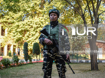 A security personnel stands guard in Srinagar, Jammu and Kashmir, on October 22, 2024. Security forces are on high alert after a recent mili...