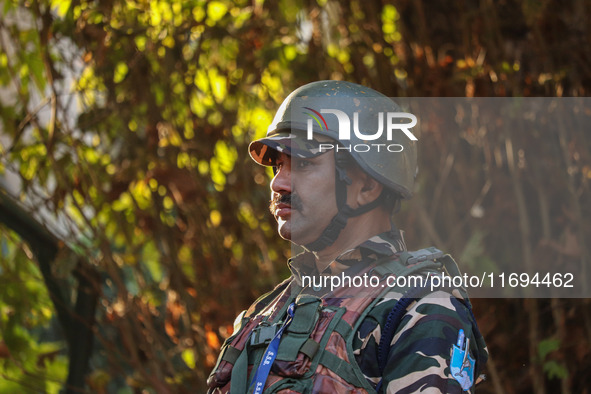 A security personnel stands guard in Srinagar, Jammu and Kashmir, on October 22, 2024. Security forces are on high alert after a recent mili...