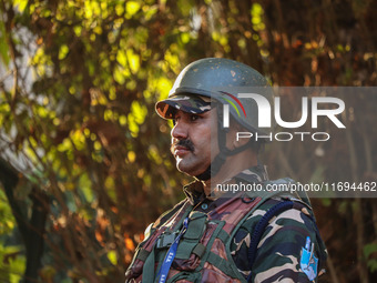 A security personnel stands guard in Srinagar, Jammu and Kashmir, on October 22, 2024. Security forces are on high alert after a recent mili...