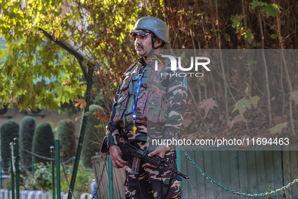 A security personnel stands guard in Srinagar, Jammu and Kashmir, on October 22, 2024. Security forces are on high alert after a recent mili...