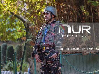 A security personnel stands guard in Srinagar, Jammu and Kashmir, on October 22, 2024. Security forces are on high alert after a recent mili...