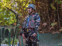 A security personnel stands guard in Srinagar, Jammu and Kashmir, on October 22, 2024. Security forces are on high alert after a recent mili...