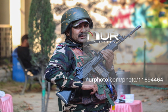 A security personnel stands guard in Srinagar, Jammu and Kashmir, on October 22, 2024. Security forces are on high alert after a recent mili...