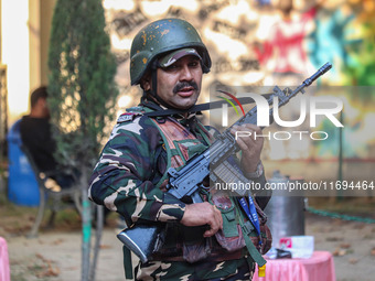 A security personnel stands guard in Srinagar, Jammu and Kashmir, on October 22, 2024. Security forces are on high alert after a recent mili...