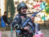 A security personnel stands guard in Srinagar, Jammu and Kashmir, on October 22, 2024. Security forces are on high alert after a recent mili...