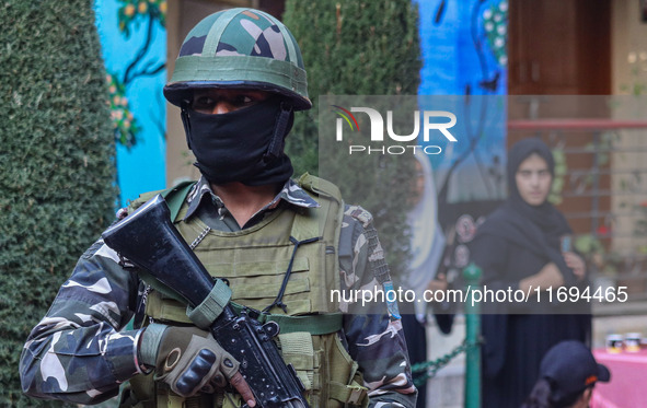 A security personnel stands guard in Srinagar, Jammu and Kashmir, on October 22, 2024. Security forces are on high alert after a recent mili...