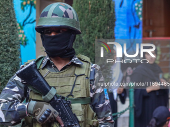 A security personnel stands guard in Srinagar, Jammu and Kashmir, on October 22, 2024. Security forces are on high alert after a recent mili...