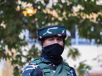 A security personnel stands guard in Srinagar, Jammu and Kashmir, on October 22, 2024. Security forces are on high alert after a recent mili...