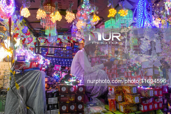 An old man sells decorative lights in his shop ahead of the Diwali festival celebration in Kolkata, India, on October 22, 2024. 