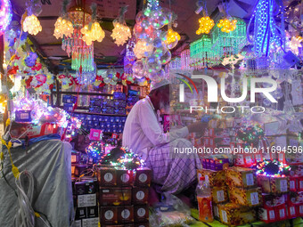 An old man sells decorative lights in his shop ahead of the Diwali festival celebration in Kolkata, India, on October 22, 2024. (