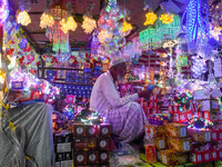 An old man sells decorative lights in his shop ahead of the Diwali festival celebration in Kolkata, India, on October 22, 2024. (