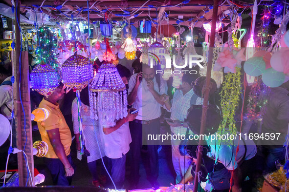 People buy decorative lights ahead of the Diwali festival celebration in Kolkata, India, on October 22, 2024. 