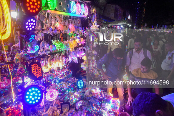 People buy decorative lights ahead of the Diwali festival celebration in Kolkata, India, on October 22, 2024. 