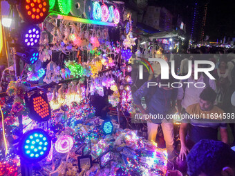 People buy decorative lights ahead of the Diwali festival celebration in Kolkata, India, on October 22, 2024. (