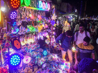 People buy decorative lights ahead of the Diwali festival celebration in Kolkata, India, on October 22, 2024. (