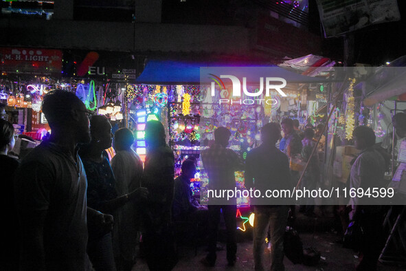 People buy decorative lights ahead of the Diwali festival celebration in Kolkata, India, on October 22, 2024. 