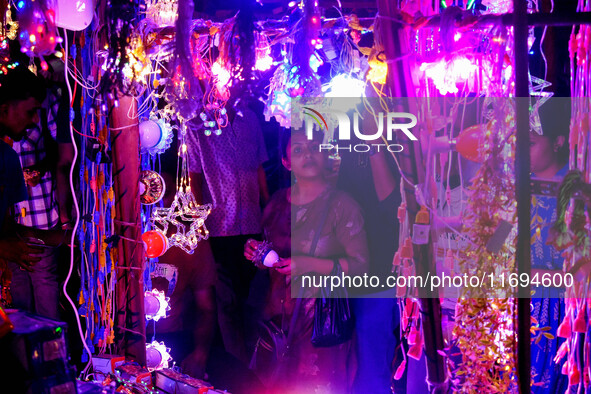 People buy decorative lights ahead of the Diwali festival celebration in Kolkata, India, on October 22, 2024. 