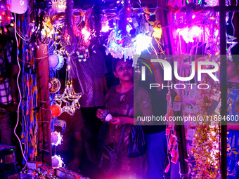 People buy decorative lights ahead of the Diwali festival celebration in Kolkata, India, on October 22, 2024. (