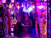 People buy decorative lights ahead of the Diwali festival celebration in Kolkata, India, on October 22, 2024. (