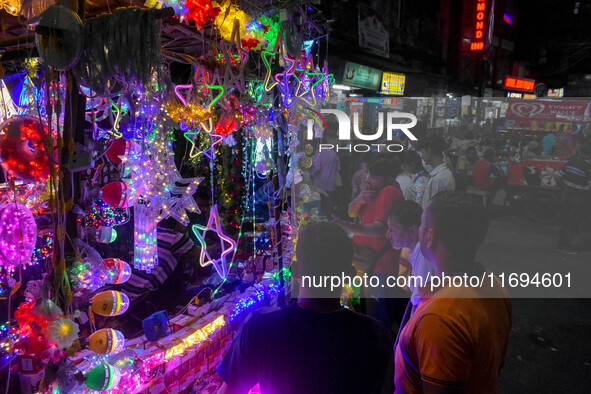 People buy decorative lights ahead of the Diwali festival celebration in Kolkata, India, on October 22, 2024. 