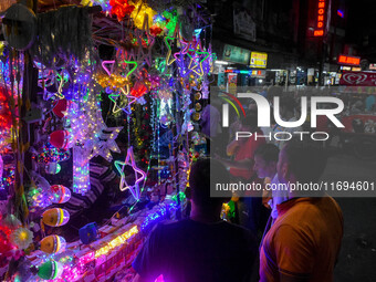 People buy decorative lights ahead of the Diwali festival celebration in Kolkata, India, on October 22, 2024. (