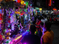 People buy decorative lights ahead of the Diwali festival celebration in Kolkata, India, on October 22, 2024. (