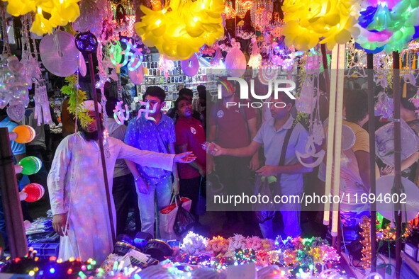 People buy decorative lights ahead of the Diwali festival celebration in Kolkata, India, on October 22, 2024. 