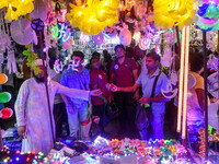 People buy decorative lights ahead of the Diwali festival celebration in Kolkata, India, on October 22, 2024. (