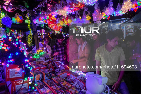 People buy decorative lights ahead of the Diwali festival celebration in Kolkata, India, on October 22, 2024. 