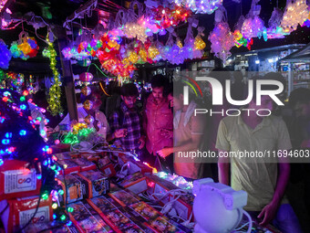 People buy decorative lights ahead of the Diwali festival celebration in Kolkata, India, on October 22, 2024. (