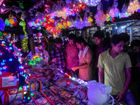 People buy decorative lights ahead of the Diwali festival celebration in Kolkata, India, on October 22, 2024. (