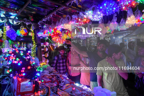 People buy decorative lights ahead of the Diwali festival celebration in Kolkata, India, on October 22, 2024. 