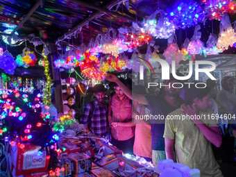 People buy decorative lights ahead of the Diwali festival celebration in Kolkata, India, on October 22, 2024. (