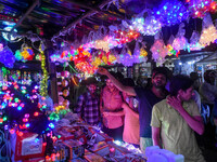 People buy decorative lights ahead of the Diwali festival celebration in Kolkata, India, on October 22, 2024. (