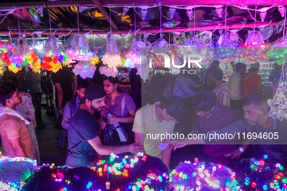 People buy decorative lights ahead of the Diwali festival celebration in Kolkata, India, on October 22, 2024. 