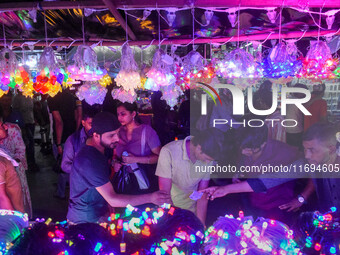 People buy decorative lights ahead of the Diwali festival celebration in Kolkata, India, on October 22, 2024. (