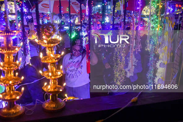 People buy decorative lights ahead of the Diwali festival celebration in Kolkata, India, on October 22, 2024. 