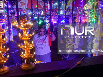 People buy decorative lights ahead of the Diwali festival celebration in Kolkata, India, on October 22, 2024. (