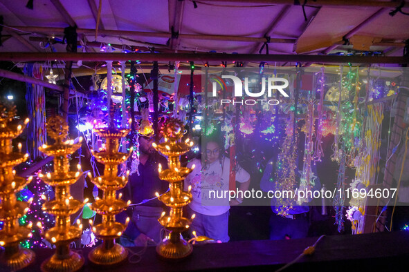 People buy decorative lights ahead of the Diwali festival celebration in Kolkata, India, on October 22, 2024. 