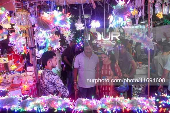 People buy decorative lights ahead of the Diwali festival celebration in Kolkata, India, on October 22, 2024. 