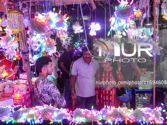 People buy decorative lights ahead of the Diwali festival celebration in Kolkata, India, on October 22, 2024. (